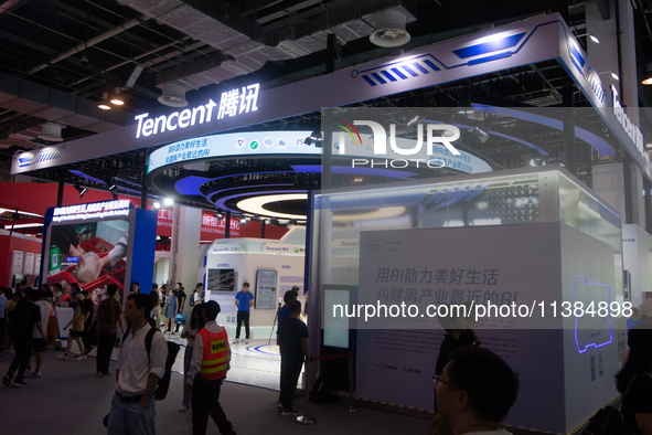 Visitors are visiting the Tencent stand at the World Artificial Intelligence Conference at the Shanghai World Expo Exhibition Center in Shan...