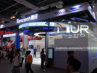 Visitors are visiting the Tencent stand at the World Artificial Intelligence Conference at the Shanghai World Expo Exhibition Center in Shan...