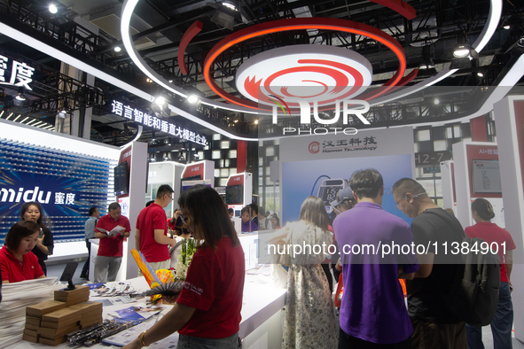 Visitors are visiting the Hanwang Technology stand at the World Artificial Intelligence Conference at the Shanghai World Expo Exhibition Cen...