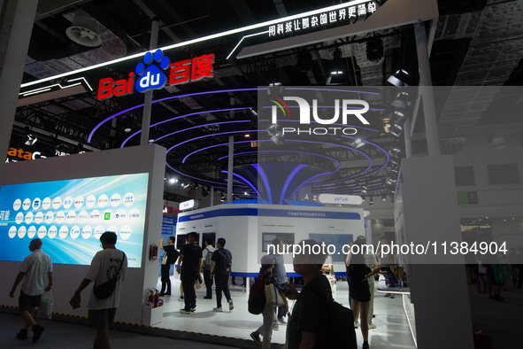 Visitors are being seen at the Baidu stand at the World Artificial Intelligence Conference at the Shanghai World Expo Exhibition Center in S...