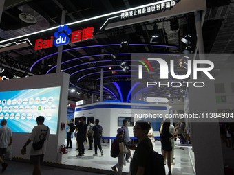 Visitors are being seen at the Baidu stand at the World Artificial Intelligence Conference at the Shanghai World Expo Exhibition Center in S...