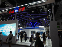 Visitors are being seen at the Baidu stand at the World Artificial Intelligence Conference at the Shanghai World Expo Exhibition Center in S...