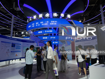 Visitors are being seen at the Baidu stand at the World Artificial Intelligence Conference at the Shanghai World Expo Exhibition Center in S...