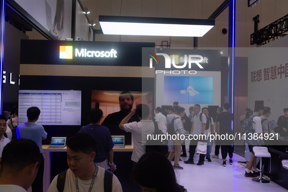 Visitors are seeing the Microsoft stand at the World Artificial Intelligence Conference at the Shanghai World Expo Exhibition Center in Shan...