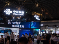 Visitors are being seen at the China Unicom stand at the World Artificial Intelligence Conference at the Shanghai World Expo Exhibition Cent...