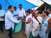 Flood-affected people are receiving relief distributed by Raijor Dal president and Sivasagar MLA Akhil Gogoi at a relief camp near Kampur in...