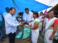 Flood-affected people are receiving relief distributed by Raijor Dal president and Sivasagar MLA Akhil Gogoi at a relief camp near Kampur in...