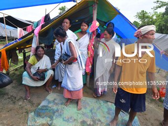 Flood-affected villagers are staying at a relief camp during the flood near Kampur in Nagaon District of Assam, India, on July 5, 2024. (