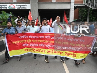 Activists of the Garments Workers Front are staging a protest rally demanding payment of ration and dearness allowance for garment workers i...