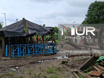 Houses are being seen as the Teesta River water enters Laltong forest village due to heavy and continuous rainfall in the area. The village...