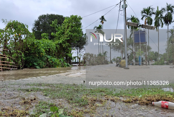 Houses are being seen as the Teesta River water enters Laltong forest village due to heavy and continuous rainfall in the area. The village...