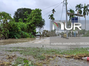 Houses are being seen as the Teesta River water enters Laltong forest village due to heavy and continuous rainfall in the area. The village...