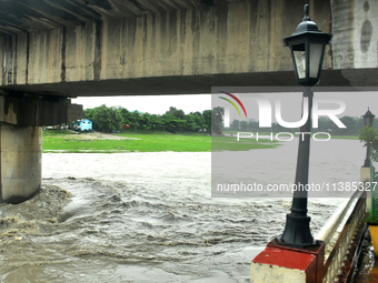 The Mahananda River water level is rising and flowing in Siliguri, India, on July 5, 2024. (