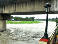 The Mahananda River water level is rising and flowing in Siliguri, India, on July 5, 2024. (