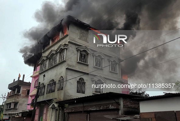 A fire tender vehicle is dousing a fire at a residential apartment in Majhabari village area near Siliguri, India, on July 5, 2024. A fire i...