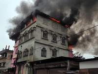 A fire tender vehicle is dousing a fire at a residential apartment in Majhabari village area near Siliguri, India, on July 5, 2024. A fire i...