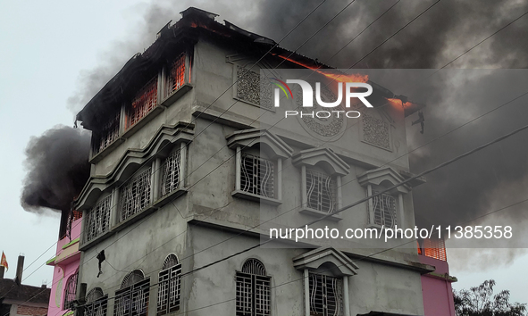 A fire tender vehicle is dousing a fire at a residential apartment in Majhabari village area near Siliguri, India, on July 5, 2024. A fire i...