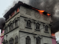 A fire tender vehicle is dousing a fire at a residential apartment in Majhabari village area near Siliguri, India, on July 5, 2024. A fire i...