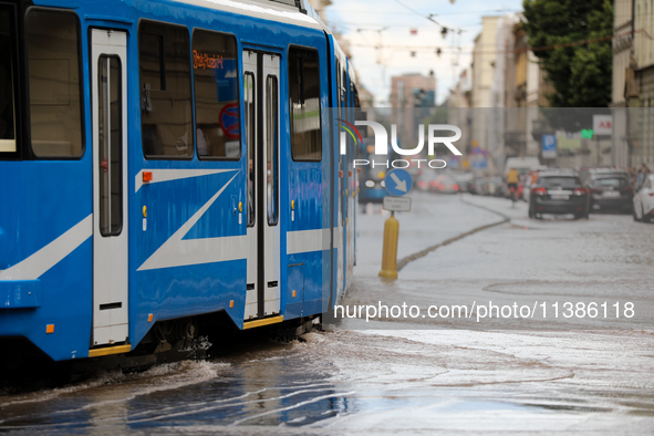 Flooding is occurring due to a water mains failure near the former Main Post Office in Krakow, Poland, on July 4, 2024. 