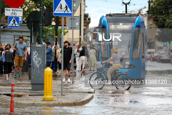 Flooding is occurring due to a water mains failure near the former Main Post Office in Krakow, Poland, on July 4, 2024. 