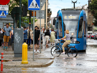 Flooding is occurring due to a water mains failure near the former Main Post Office in Krakow, Poland, on July 4, 2024. (