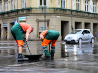 Emergency water supply is being provided during flooding due to a water mains failure near the former Main Post Office in Krakow, Poland, on...