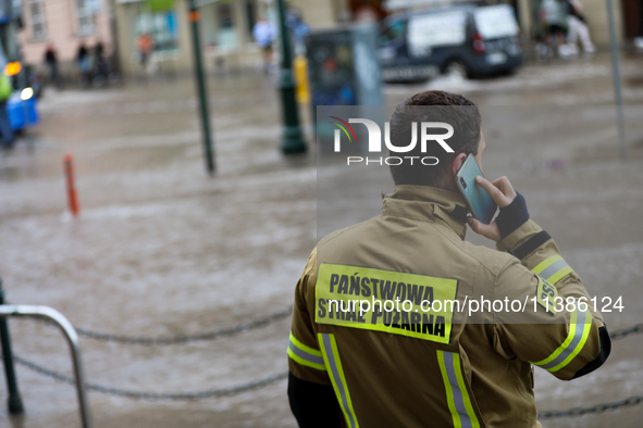 The fire brigade is responding to flooding due to a water mains failure near the former Main Post Office in Krakow, Poland, on July 4, 2024....