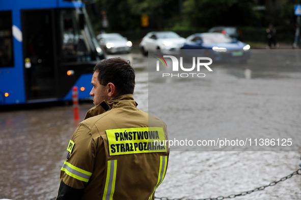 The fire brigade is responding to flooding due to a water mains failure near the former Main Post Office in Krakow, Poland, on July 4, 2024....