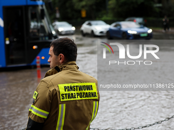 The fire brigade is responding to flooding due to a water mains failure near the former Main Post Office in Krakow, Poland, on July 4, 2024....