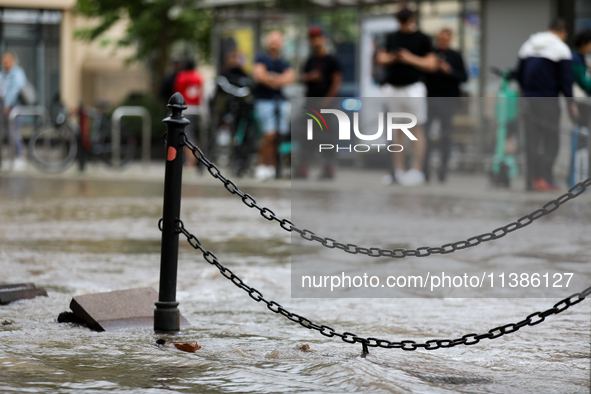 Flooding is occurring due to a water mains failure near the former Main Post Office in Krakow, Poland, on July 4, 2024. 