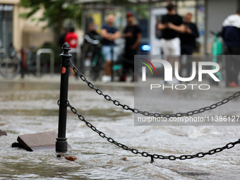 Flooding is occurring due to a water mains failure near the former Main Post Office in Krakow, Poland, on July 4, 2024. (