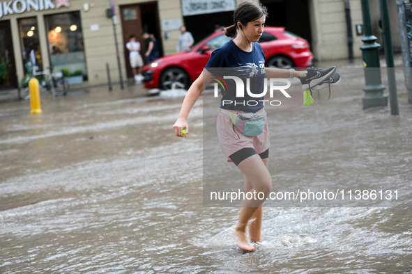 Flooding is occurring due to a water mains failure near the former Main Post Office in Krakow, Poland, on July 4, 2024. 