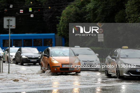 Flooding is occurring due to a water mains failure near the former Main Post Office in Krakow, Poland, on July 4, 2024. 