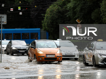 Flooding is occurring due to a water mains failure near the former Main Post Office in Krakow, Poland, on July 4, 2024. (