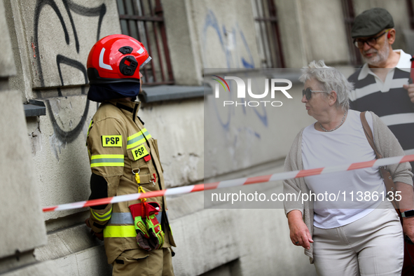 The fire brigade is responding to flooding due to a water mains failure near the former Main Post Office in Krakow, Poland, on July 4, 2024....