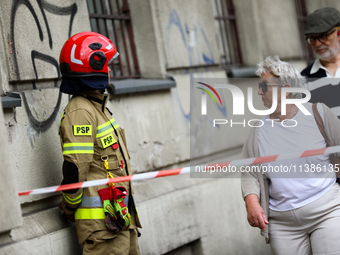 The fire brigade is responding to flooding due to a water mains failure near the former Main Post Office in Krakow, Poland, on July 4, 2024....