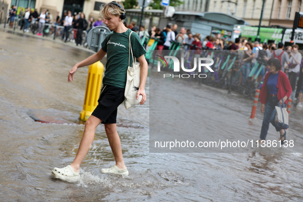 Flooding is occurring due to a water mains failure near the former Main Post Office in Krakow, Poland, on July 4, 2024. 