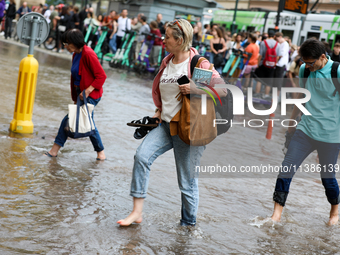 Flooding is occurring due to a water mains failure near the former Main Post Office in Krakow, Poland, on July 4, 2024. (