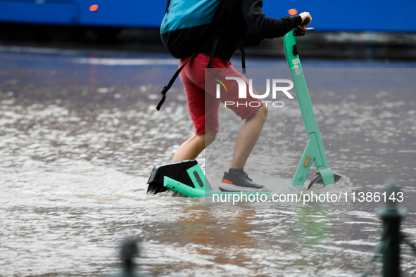 Flooding is occurring due to a water mains failure near the former Main Post Office in Krakow, Poland, on July 4, 2024. 