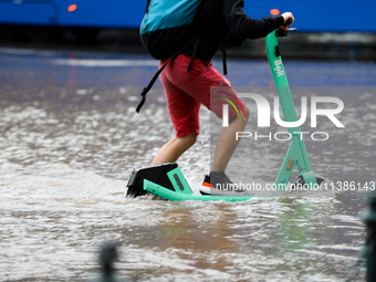 Flooding is occurring due to a water mains failure near the former Main Post Office in Krakow, Poland, on July 4, 2024. (