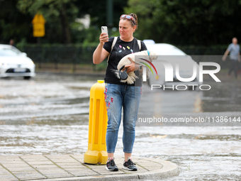 Flooding is occurring due to a water mains failure near the former Main Post Office in Krakow, Poland, on July 4, 2024. (