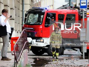 The fire brigade is responding to flooding due to a water mains failure near the former Main Post Office in Krakow, Poland, on July 4, 2024....