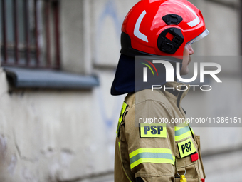 The fire brigade is responding to flooding due to a water mains failure near the former Main Post Office in Krakow, Poland, on July 4, 2024....