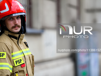 The fire brigade is responding to flooding due to a water mains failure near the former Main Post Office in Krakow, Poland, on July 4, 2024....