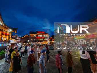 Tourists are enjoying Tea Horse Ancient City in Pu'er, Yunnan province, China, on July 1, 2024. (