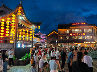 Tourists are enjoying Tea Horse Ancient City in Pu'er, Yunnan province, China, on July 1, 2024. (