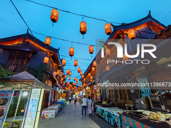 Tourists are enjoying Tea Horse Ancient City in Pu'er, Yunnan province, China, on July 1, 2024. (