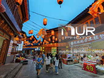 Tourists are enjoying Tea Horse Ancient City in Pu'er, Yunnan province, China, on July 1, 2024. (