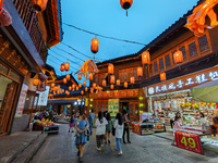 Tourists are enjoying Tea Horse Ancient City in Pu'er, Yunnan province, China, on July 1, 2024. (