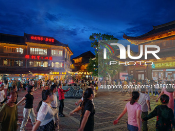 Tourists are enjoying Tea Horse Ancient City in Pu'er, Yunnan province, China, on July 1, 2024. (